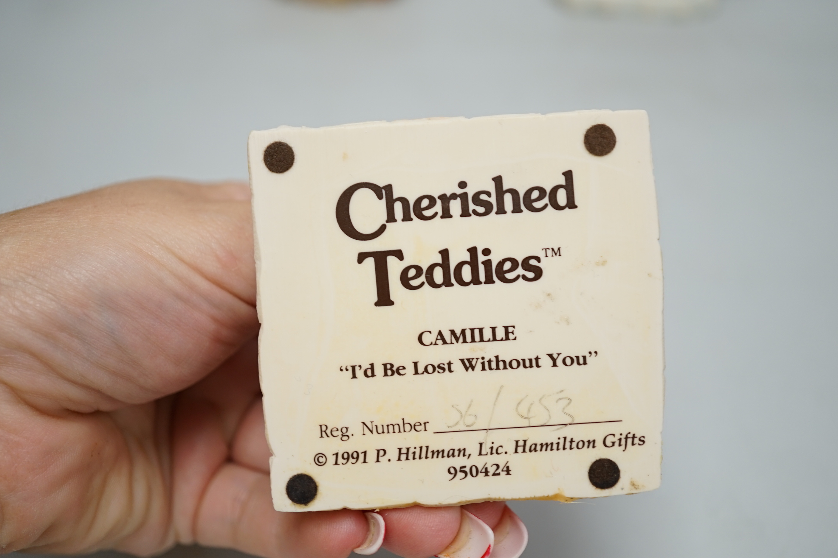 A collection of “Cherished Teddies” TM